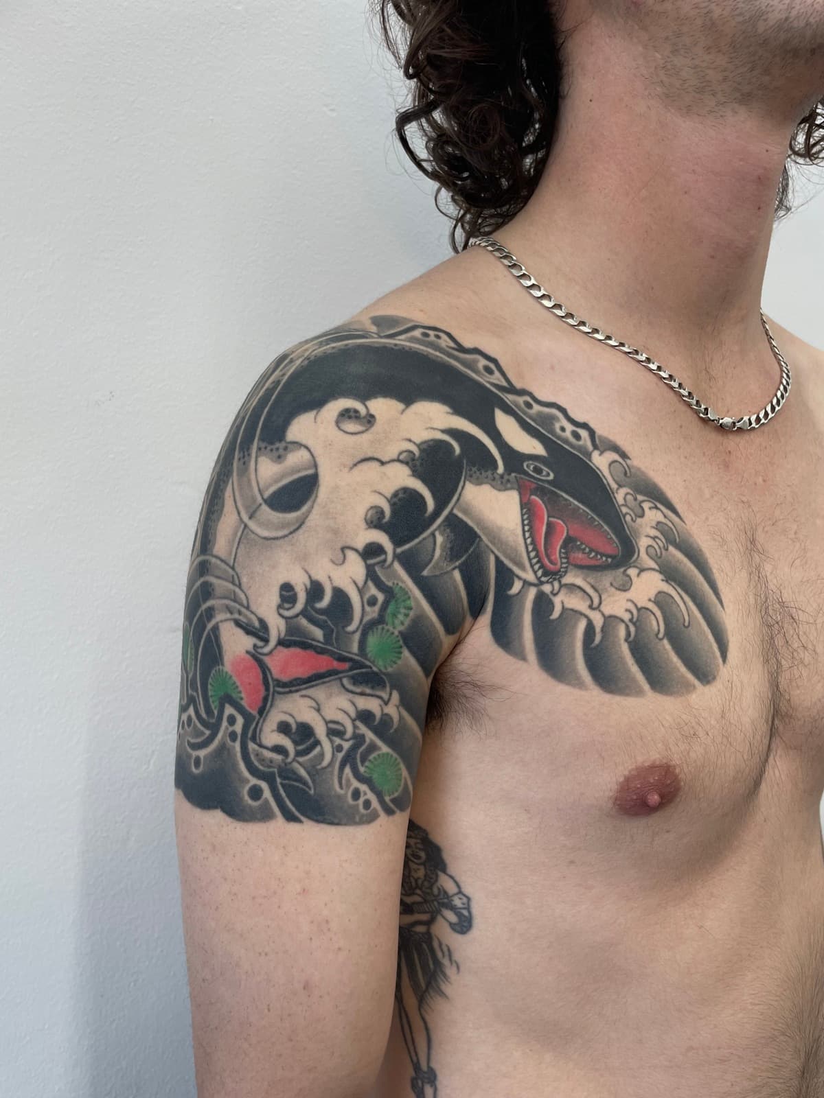 Japanese orca and crashing waves shoulder and chest piece