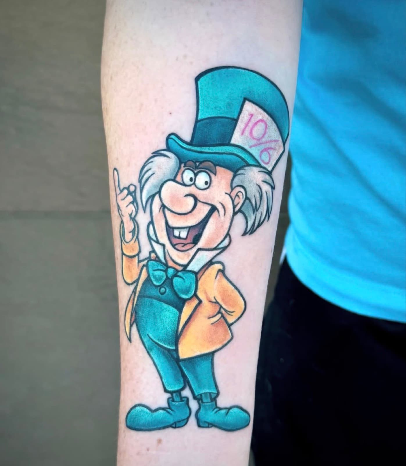 Colour Mad Hatter cartoon forearm tattoo